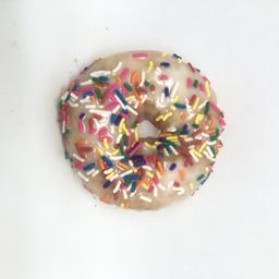 White Iced Cake with Rainbow Sprinkles